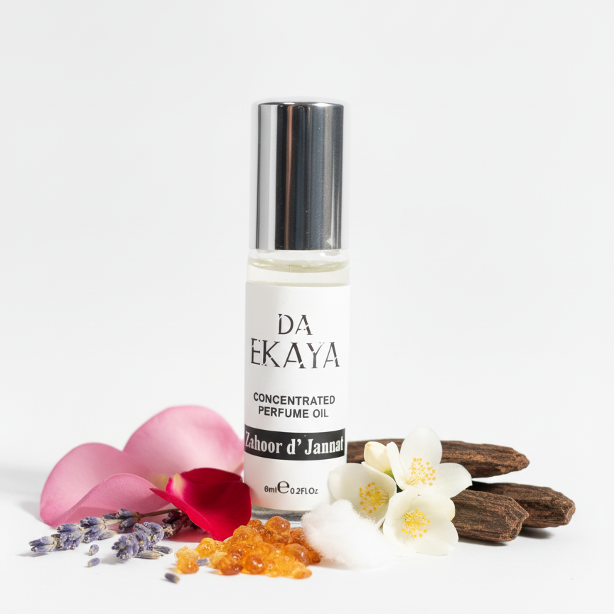 DA EKAYA concentrated perfume oil bottle with flowers and petals on a white background